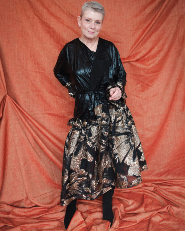 Faux Leather Convertible Coat-Dress One garment. Two statements. Infinite confidence.